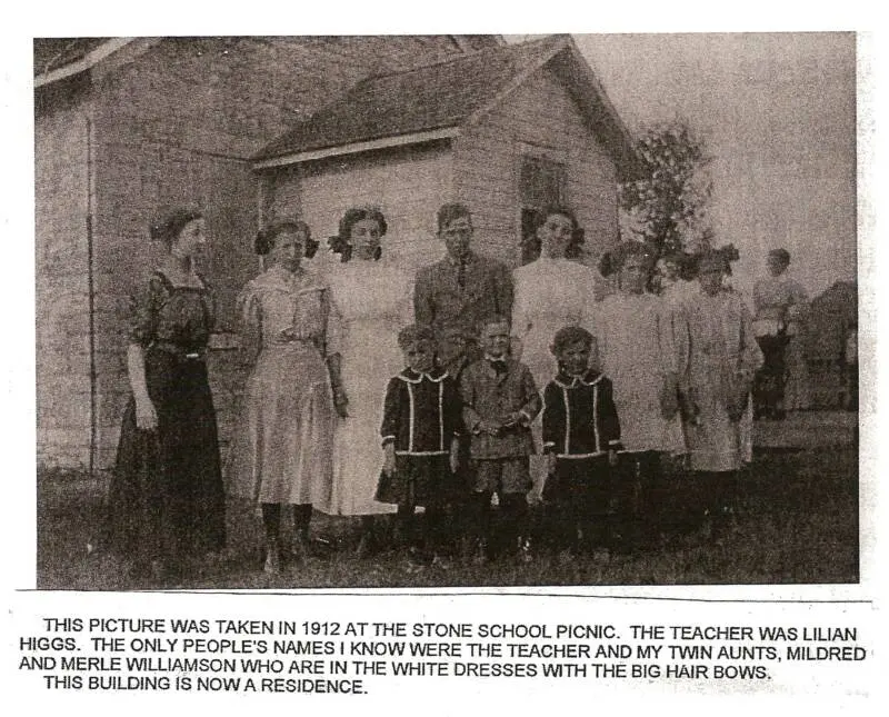 1912 Stone School picnic. Teacher Lillian Higgs; twins Mildred and Merle Williamson