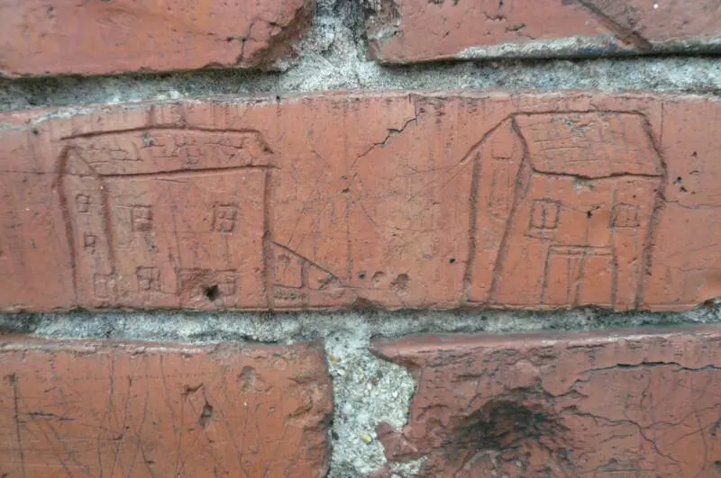 Names carved in the bricks of Phelps School